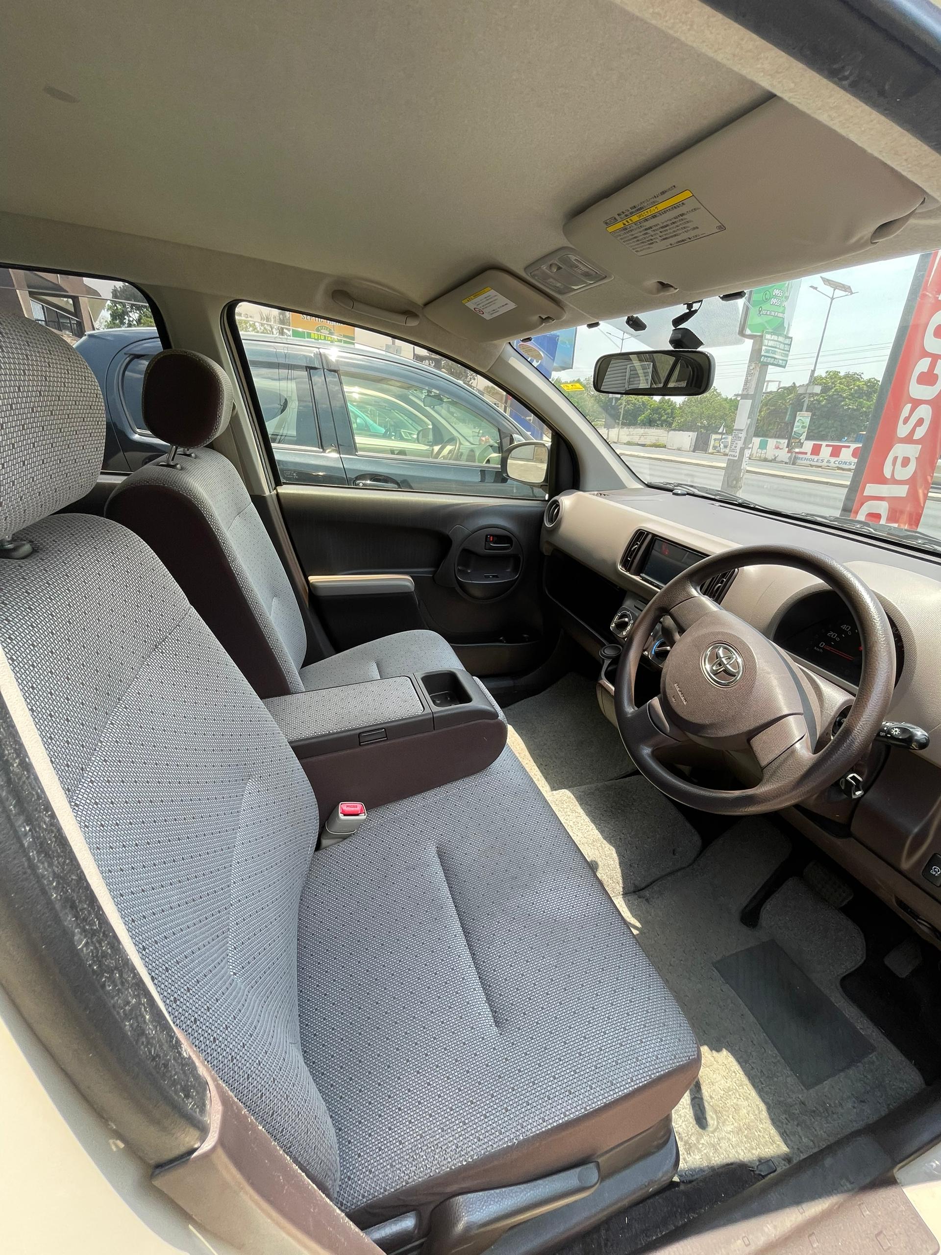 Toyota Passo Yellow 2013 - Side View